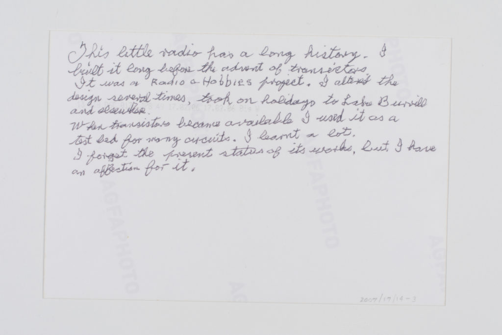 Image of the reverse of David's snapshot with handwritten notes about his connection to the radio. Transcript given in the quote below.